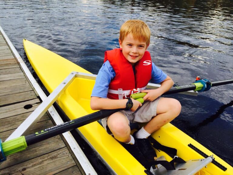 Small boy in a yellow boat